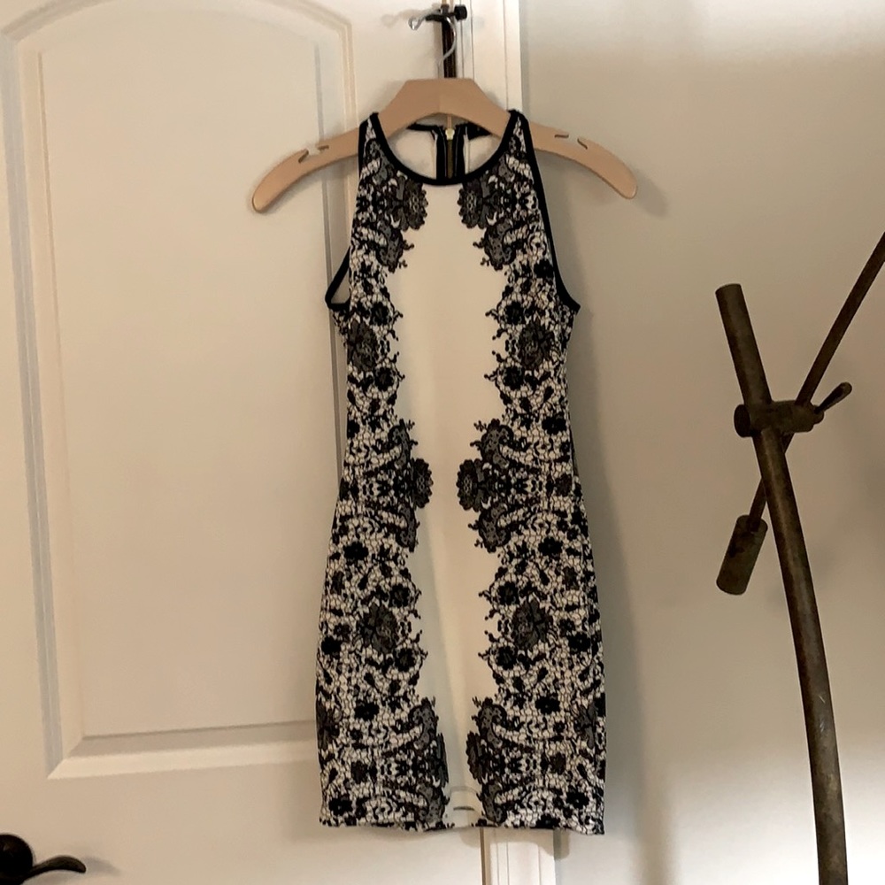 Nice black and white formal dress with a flower design. Size small and worn once